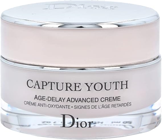 Dior Capture Youth Age-Delay Advanced Face Cream in elegant pink jar with silver lid, luxury anti-aging moisturizer for youthful skin.