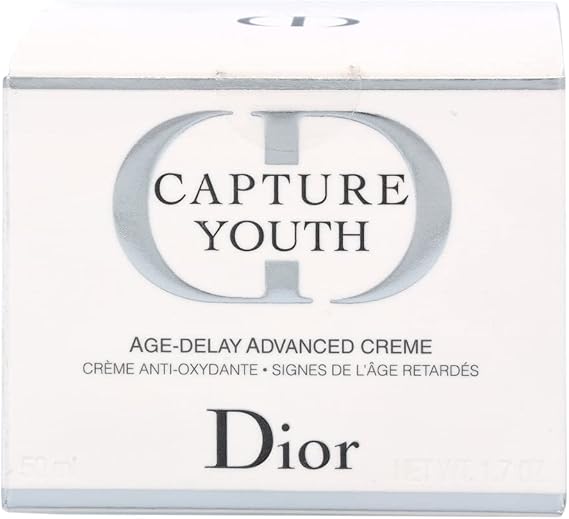 Elegant white packaging box of Dior Capture Youth Age-Delay Advanced Face Cream featuring iconic CD logo and product details.