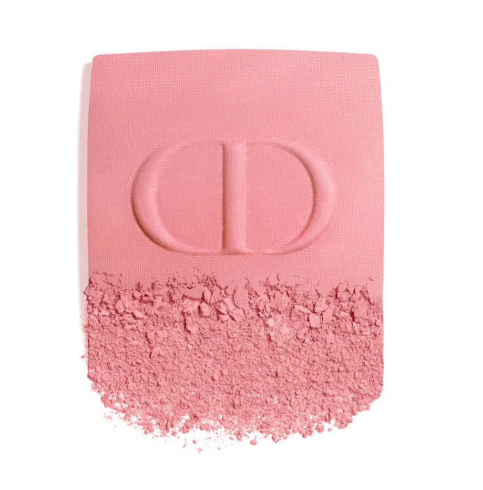 Close-up of Dior blush on powder texture and pigmentation in pink shade with CD embossing, showing fine powder consistency and color payoff.