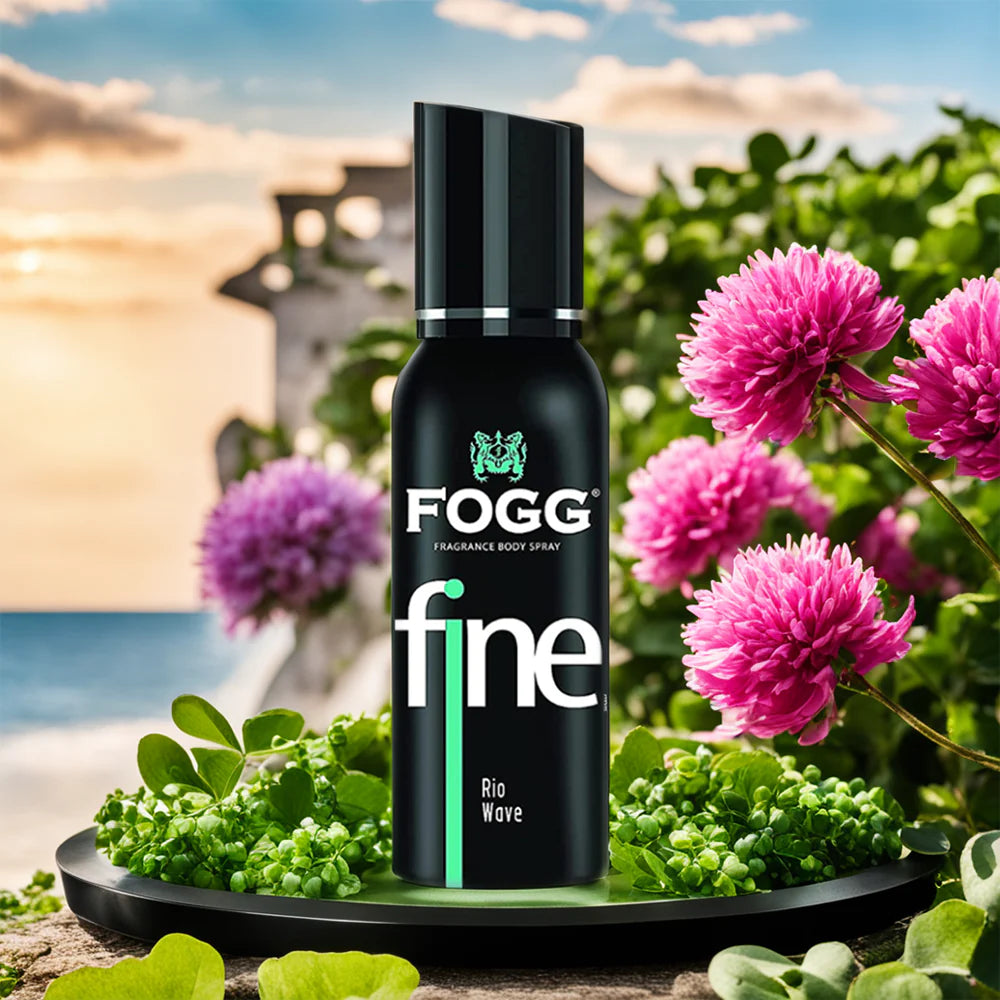 FOGG fine Rio Wave fragrance body spray bottle with pink flowers and greenery in the background