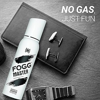 Fogg Master bottle with cufflinks and a watch on a gray surface, with text 'No Gas, Just Fun'.