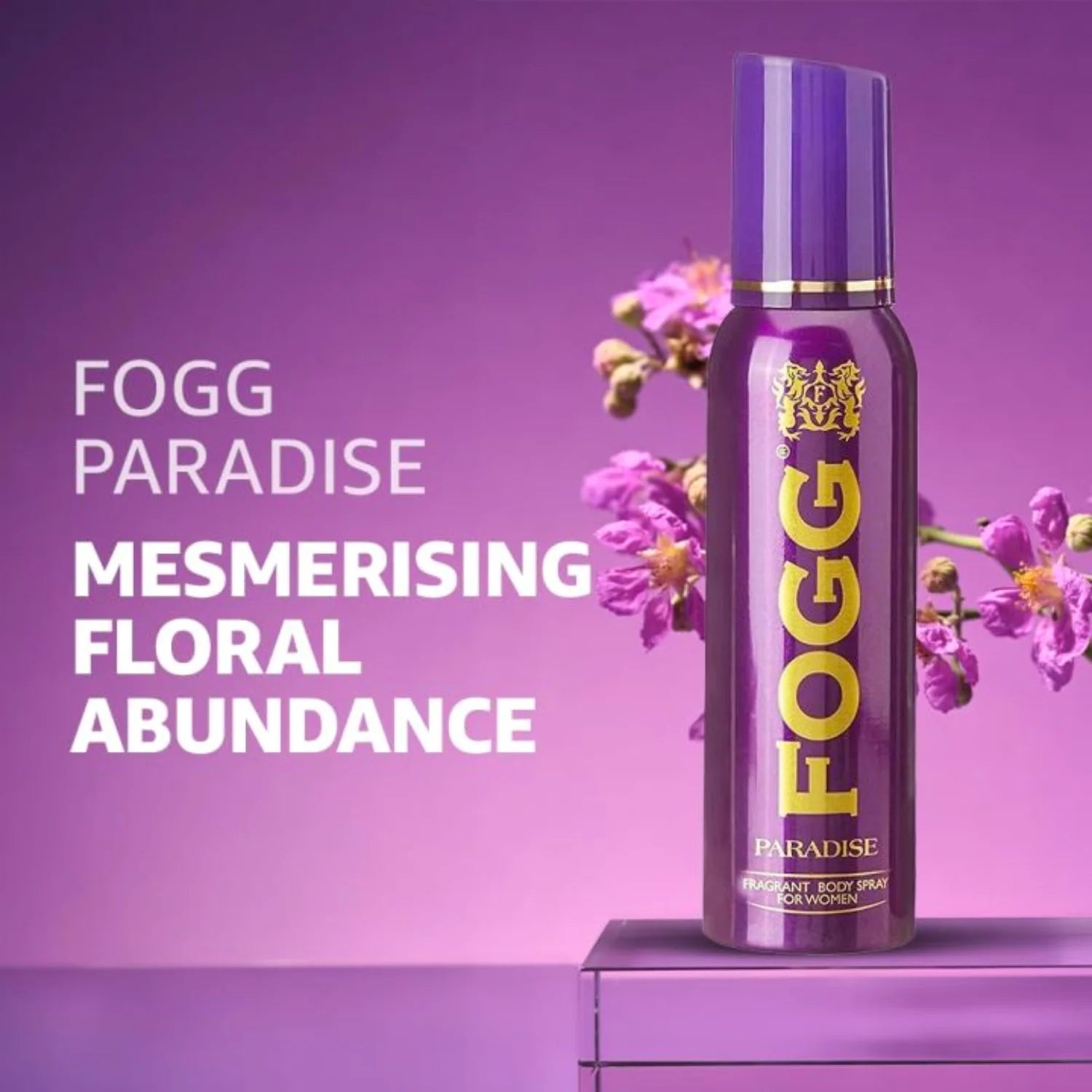 Fogg Paradise deodorant spray bottle with flowers on a purple background