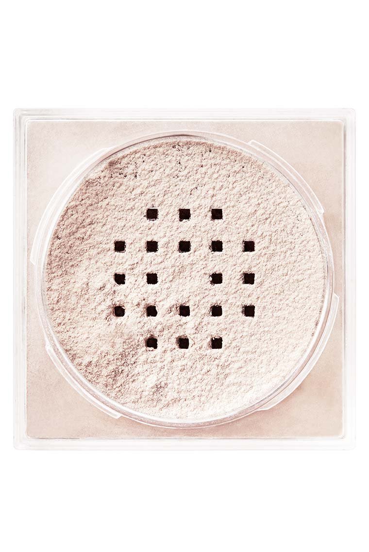 Top-down view of the Maybelline Fit Me Loose Face Powder container, showing the sifter and light powder texture.