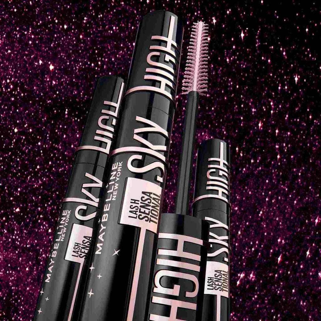 "Maybelline Mascara Sky High collection tubes with pink lettering against sparkly purple background"