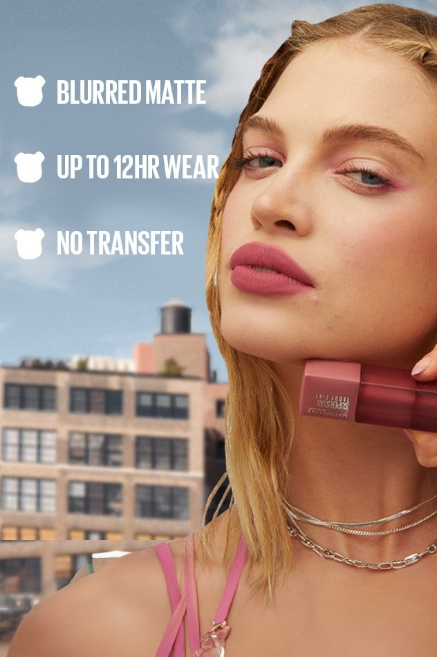 A model wearing the long-lasting Maybelline Lip Tint, highlighting its benefits like a blurred matte finish and no-transfer wear - Khayest