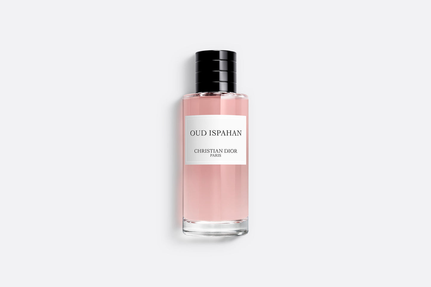 "Sophisticated Oud Ispahan Dior Perfume bottle featuring pink-tinted fragrance with minimalist design on clean white background, showcasing the elegant simplicity"