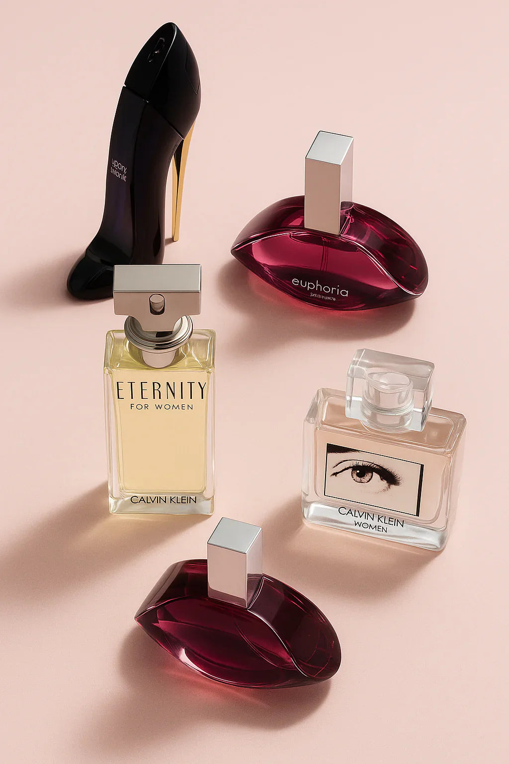 Calvin Klein women's perfumes arranged aesthetically on a soft pink background.