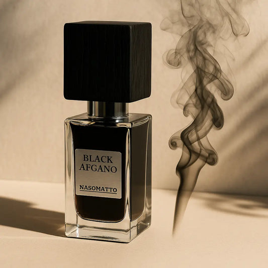 A bottle of Nasomatto Black Afgano perfume placed on a beige surface with artistic smoke rising beside it.