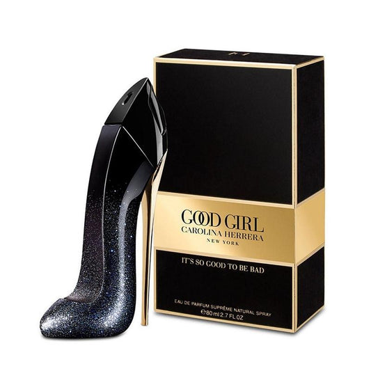 Black high-heeled shoe-shaped perfume bottle with 'Good Girl' Carolina Herrera packaging on a white background