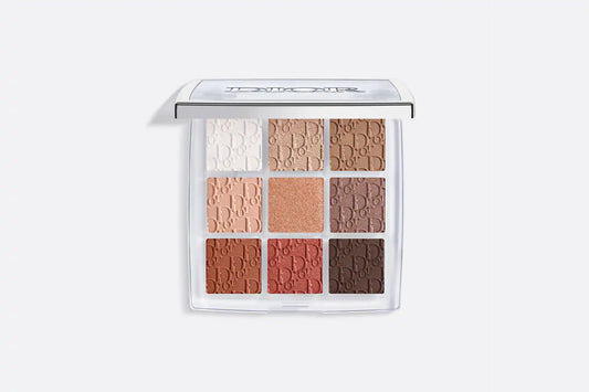 "Dior Backstage Eyeshadow Palette featuring 9 warm neutral shades in matte and shimmer finishes arranged in a white compact with Dior branding."