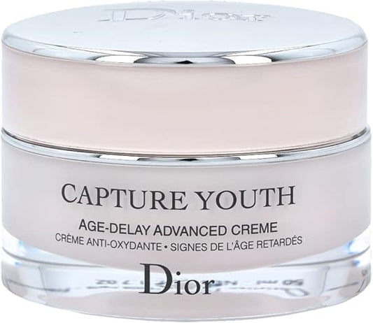 Dior Capture Youth Age-Delay Advanced Face Cream in elegant pink jar with silver lid, luxury anti-aging moisturizer for youthful skin.