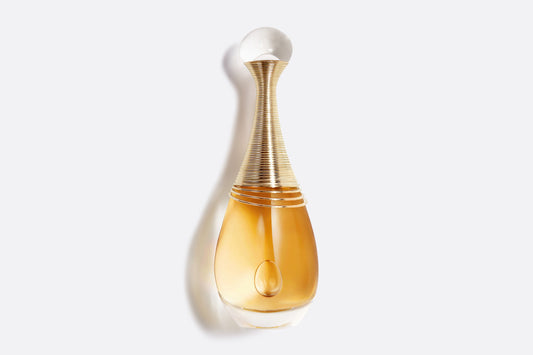 "Iconic golden Dior J'adore Infinissime perfume bottle with signature amphora shape and pearl cap, 50ml luxury women's fragrance."
