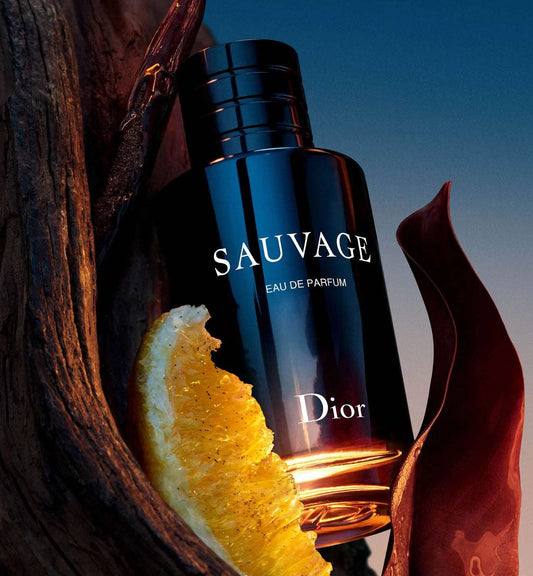 Dior Sauvage Perfume EDP 100ml for men with bergamot ingredient, showcasing the deep blue bottle against natural wood texture