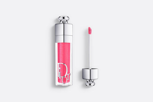 Product bottle and applicator wand of the Dior Addict Lip Maximizer plumping lip gloss.