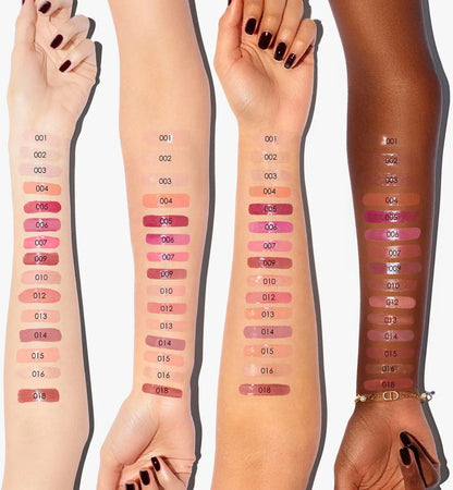 Arm swatches of the Dior Addict Lip Maximizer shade range on four different skin tones from light to deep.