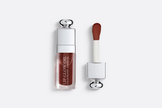 Dior Lip Glow Oil with deep brown tint, infused with cherry oil for hydration and shine.