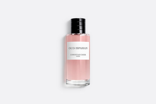 "Sophisticated Oud Ispahan Dior Perfume bottle featuring pink-tinted fragrance with minimalist design on clean white background, showcasing the elegant simplicity"